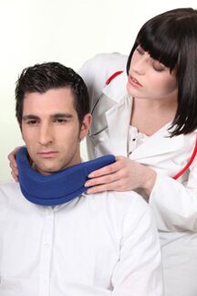 The doctor puts the patient on a shanz collar